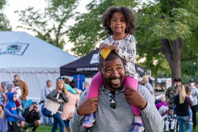 Protect your hearing at a music festival father and daughter at a music festival in San Diego
