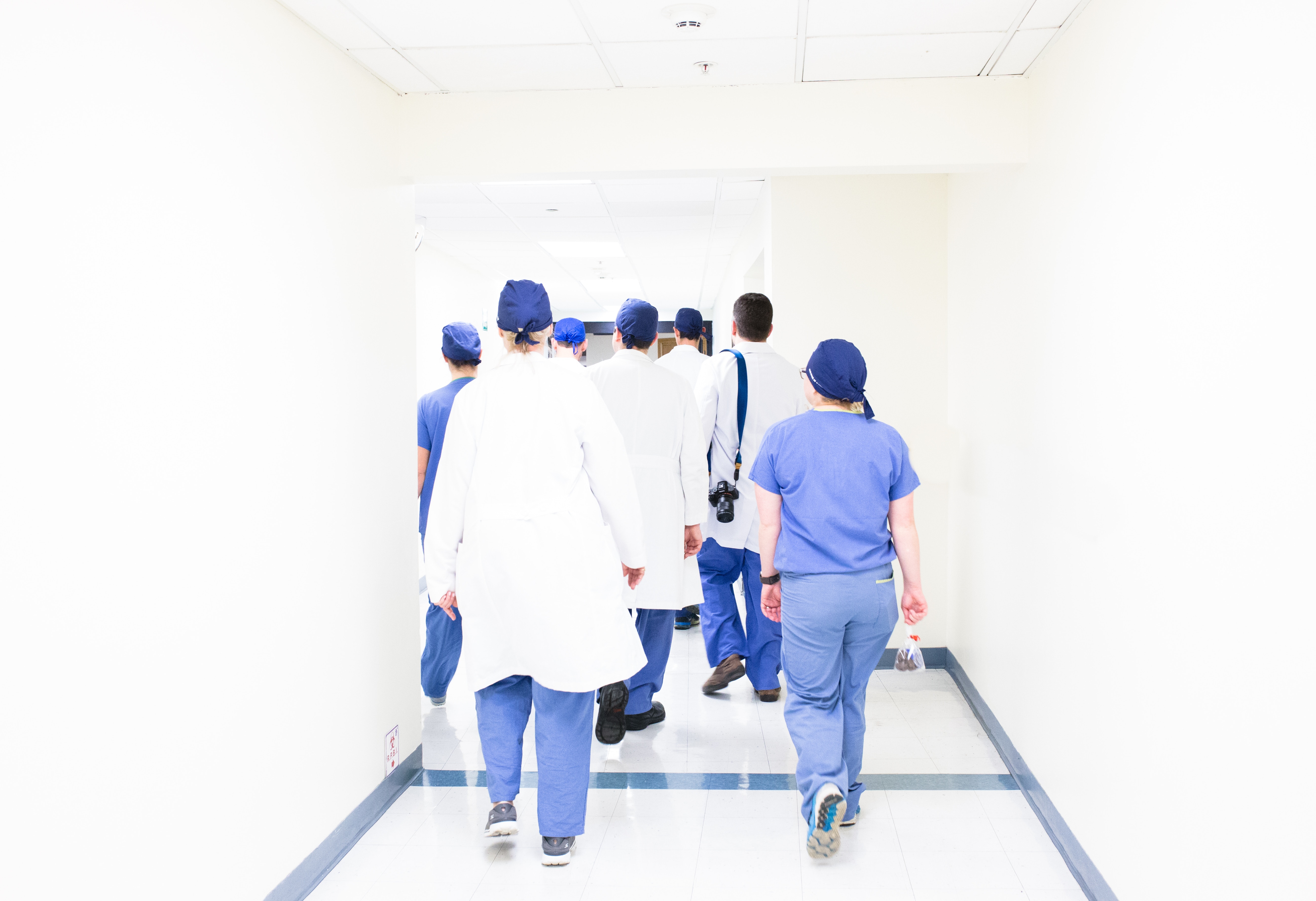 surgeons walking into an operating room 