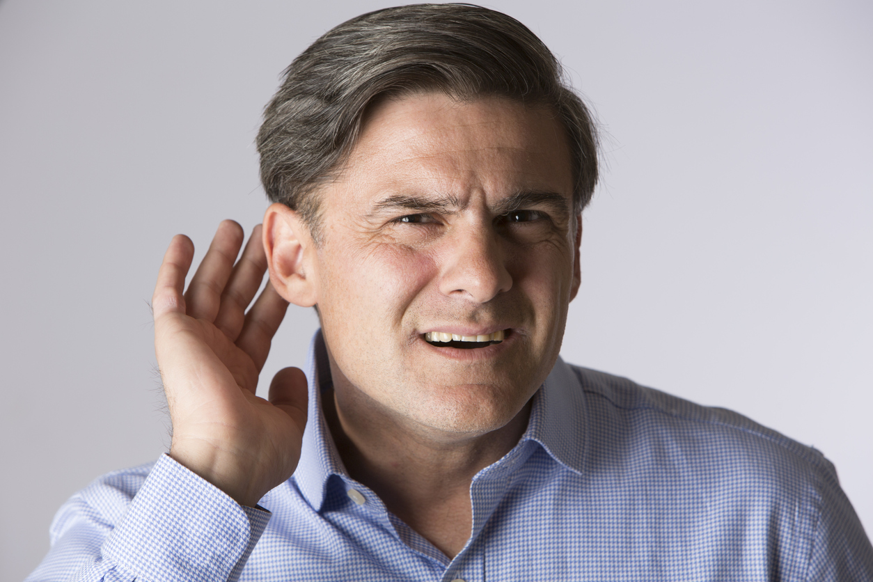 Understanding the Different Types of Hearing Loss Studio Shot Of Man Suffering From Hearing Loss